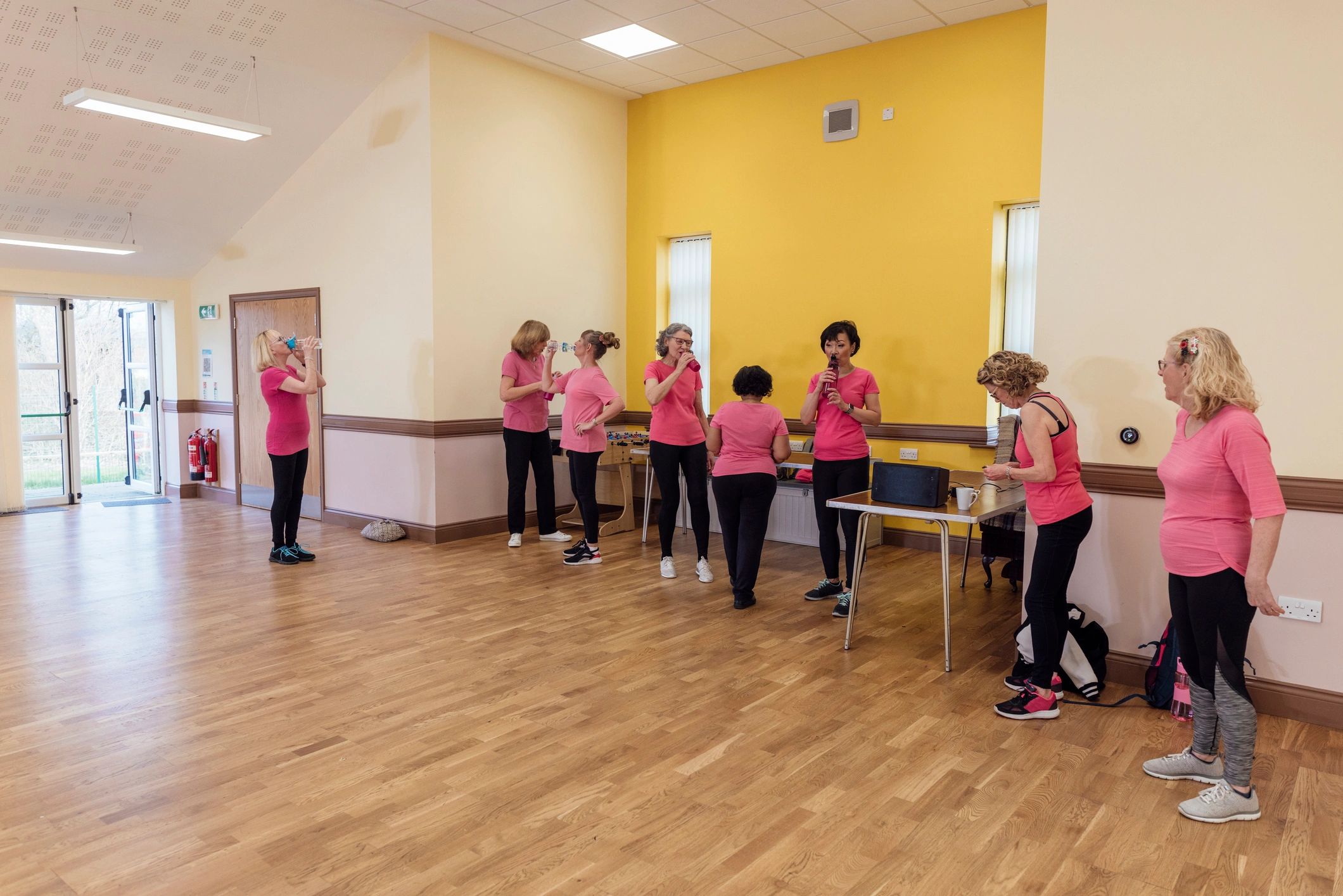 Adults taking a fun dance class together