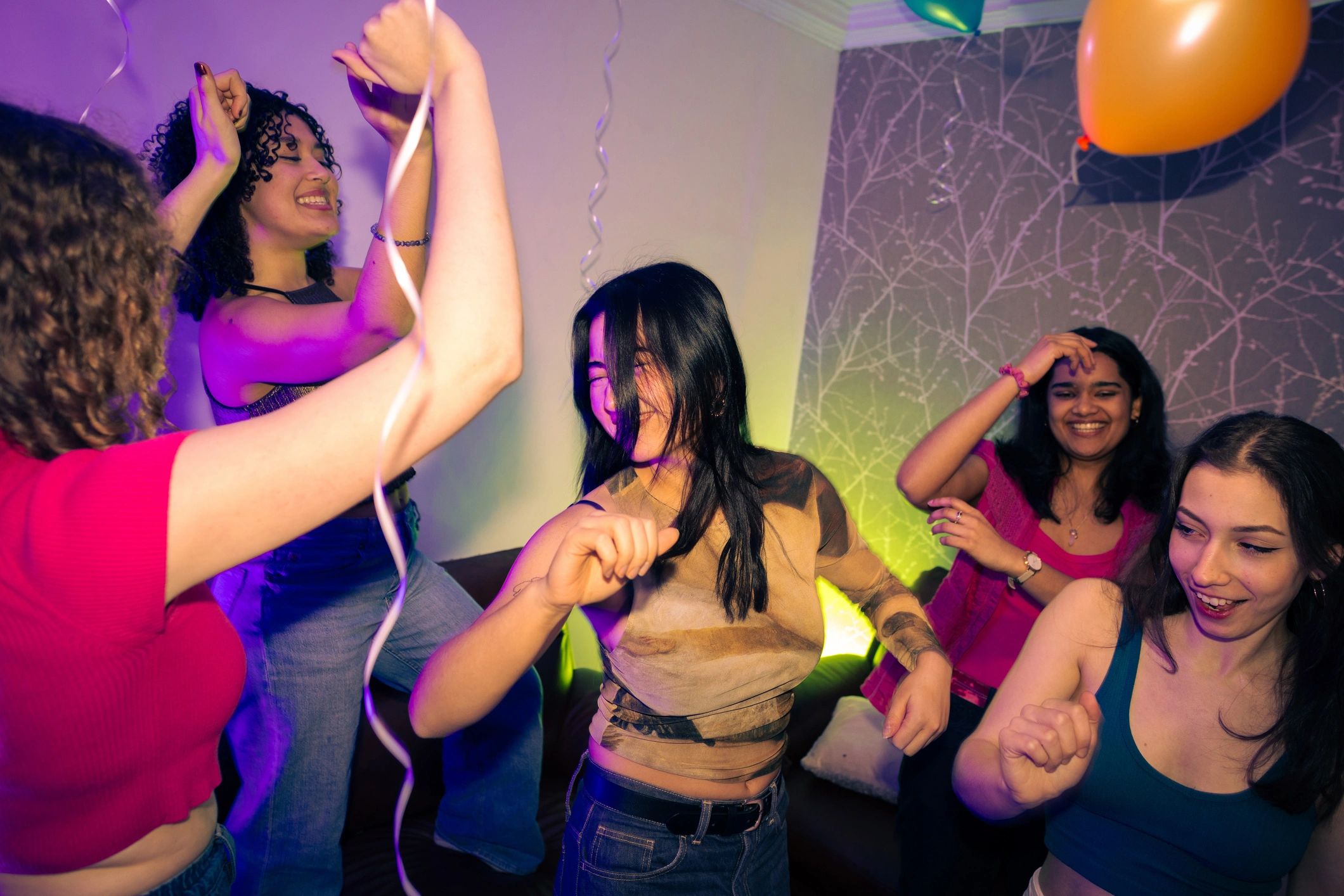 Crowd dancing together at a nightlife event